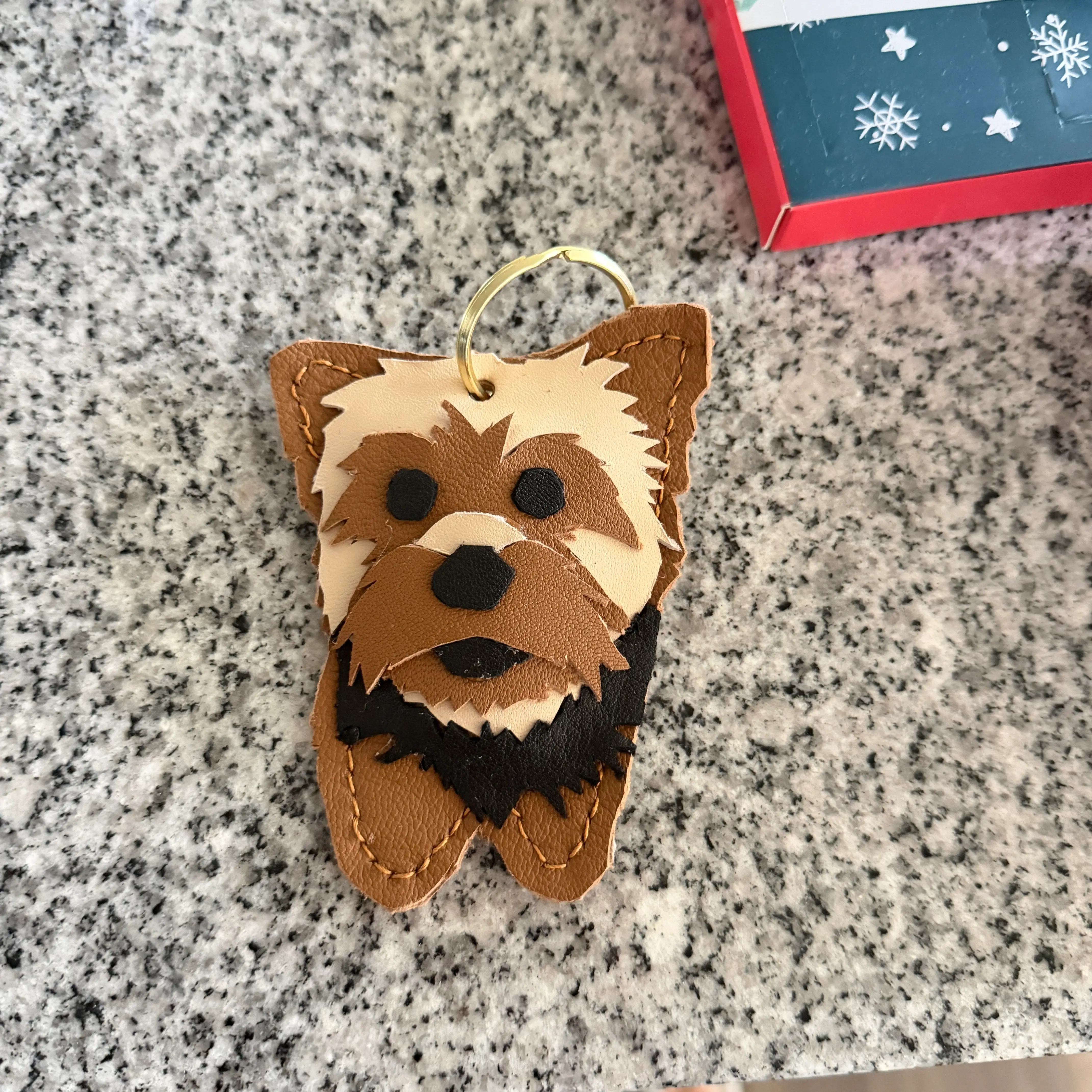 an image of a leather dog charm