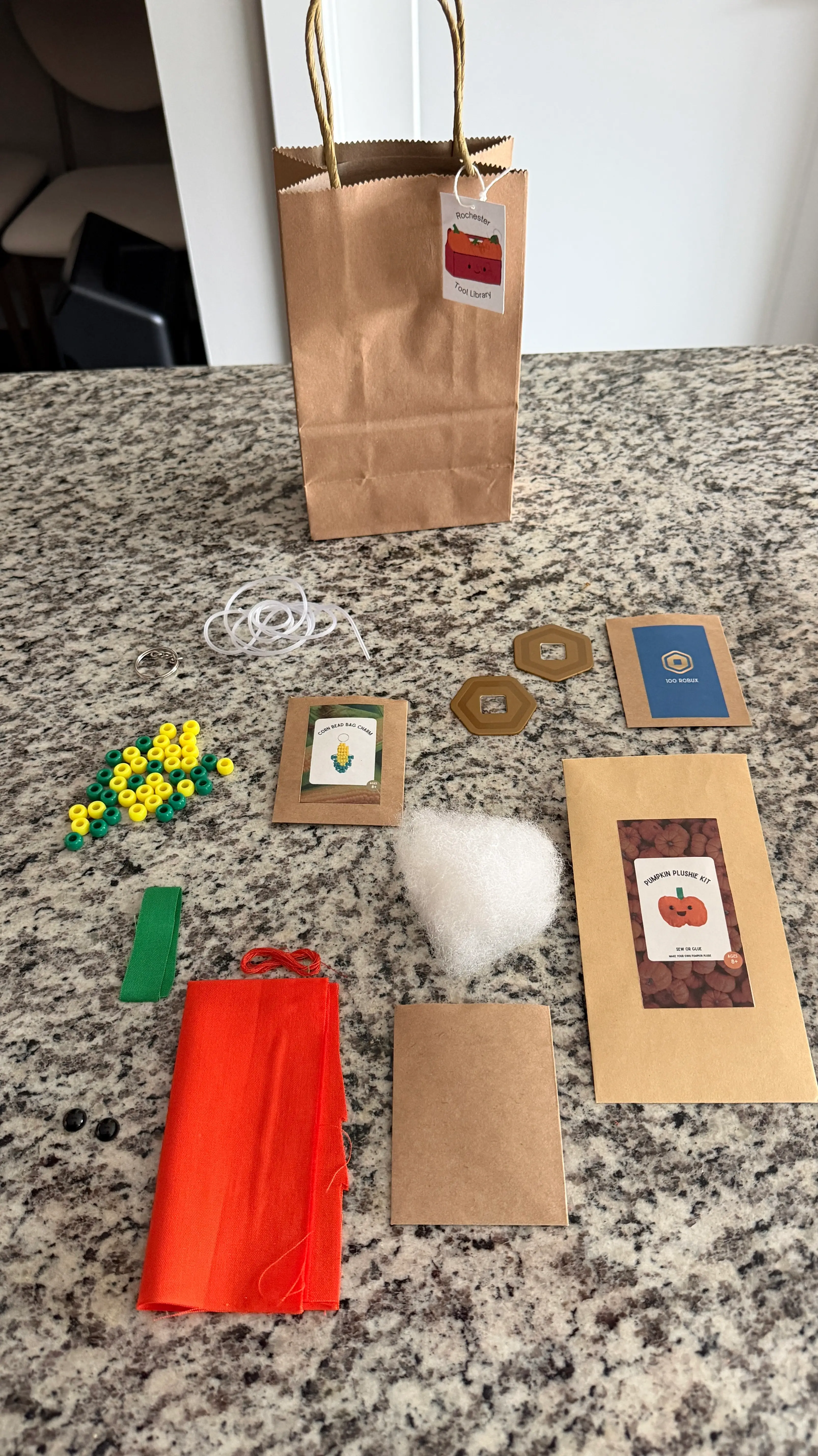 fall goody bag image showcasing pumpkin plushie kit, corn charm kit, and robux